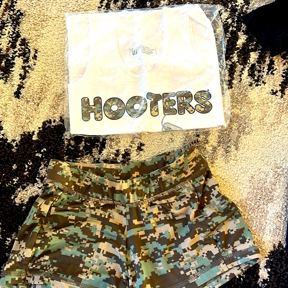 Old hooters military uniform. Xs shorts and xxs shirt. Both brand new.